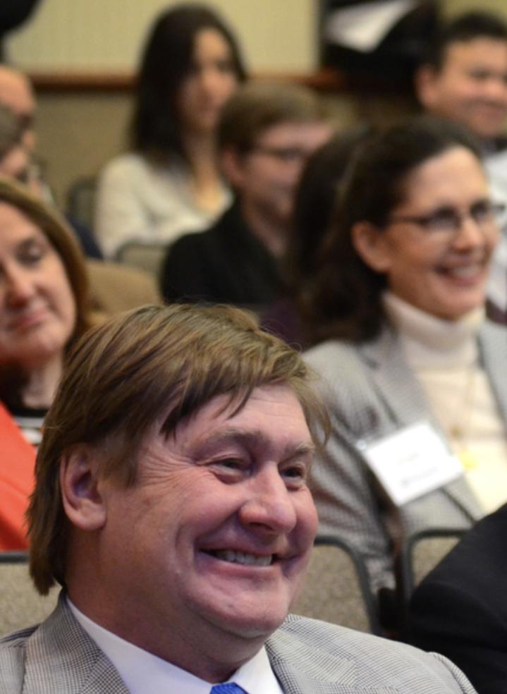 A shot of NACDD members smiling at a conference