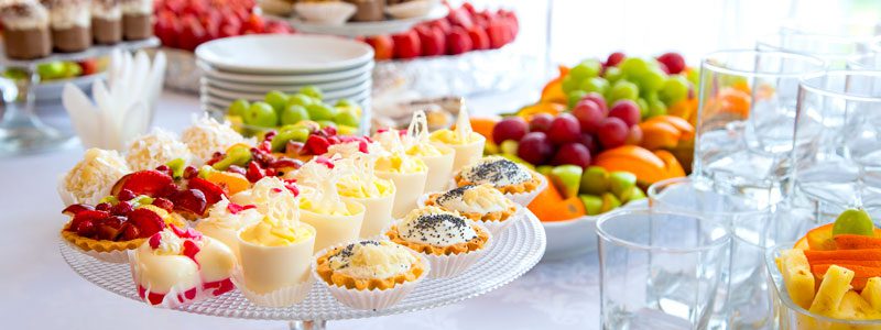 Beautifully decorated buffet spread of fruit and hors d'oeuvres