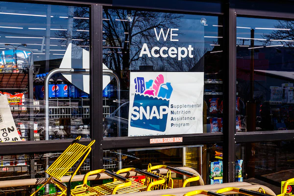 A Sign at a Retailer - We Accept SNAP stock photo