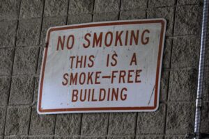 Sign on building that says, “No Smoking. This is a smoke-free building”