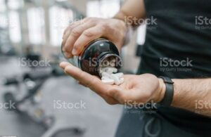 Large pills poured into an open hand
