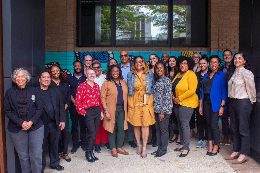 A group of NACDD staff and guests attending the Social Justice Thought Leader Roundtable pose for a photo outside of NACDD headquarters in Decatur, Georgia.