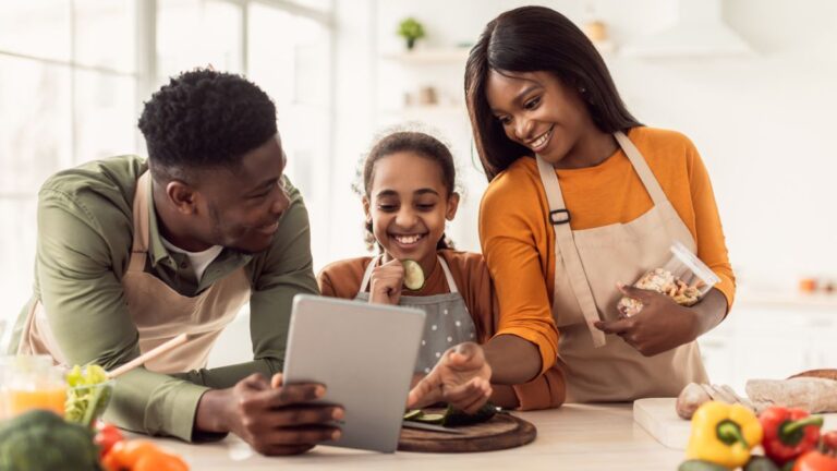 Cheerful family preparing fresh food